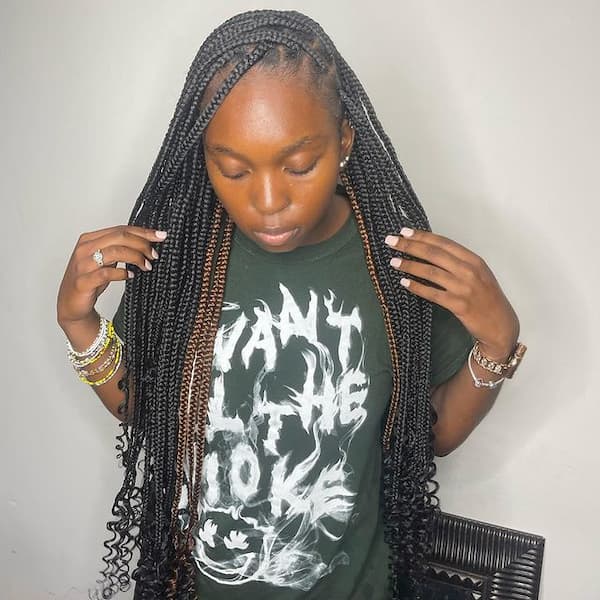 Curly Black Medium Knotless Braids With Few Brown Strands