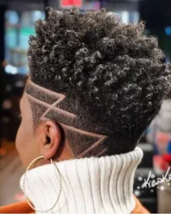 Curly Black Female Fade Haircut With Design